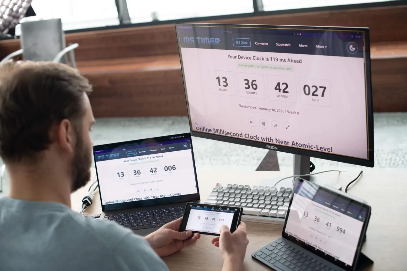 Latency test — the same clock on the remote PC, a laptop and a phone